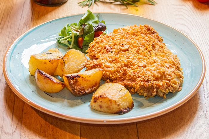 Șnițele la cuptor în crustă de fulgi de porumb