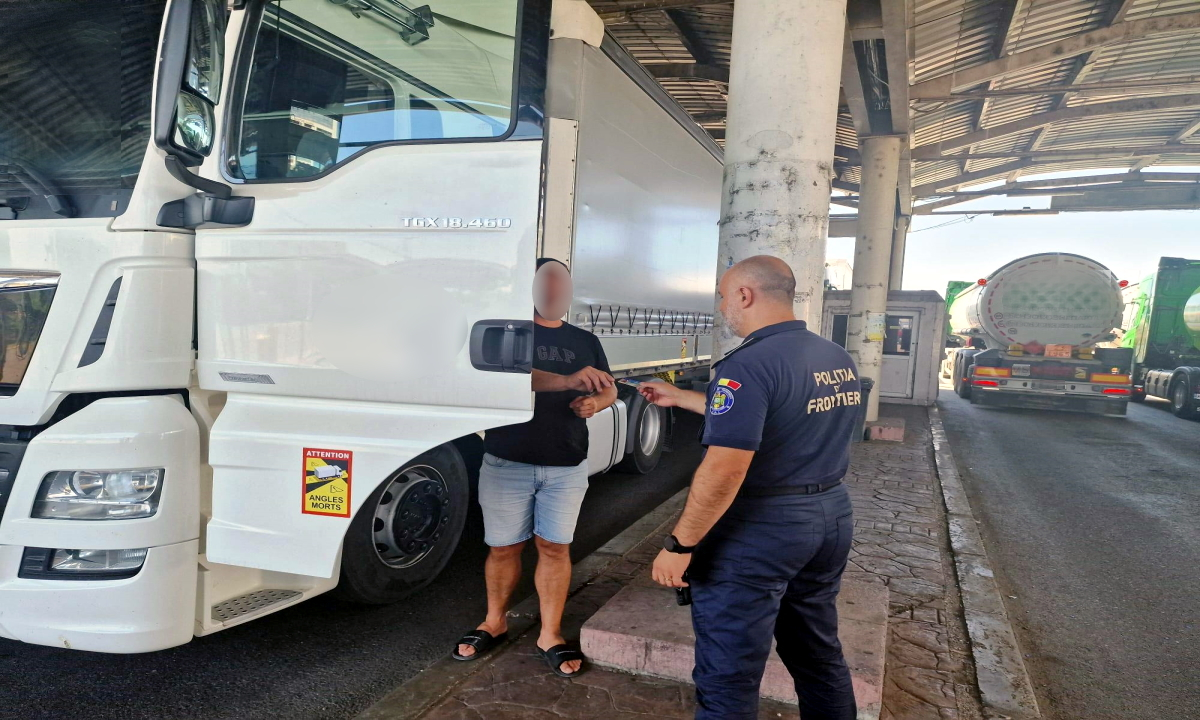 La volanul unui camion, fără a avea acest drept